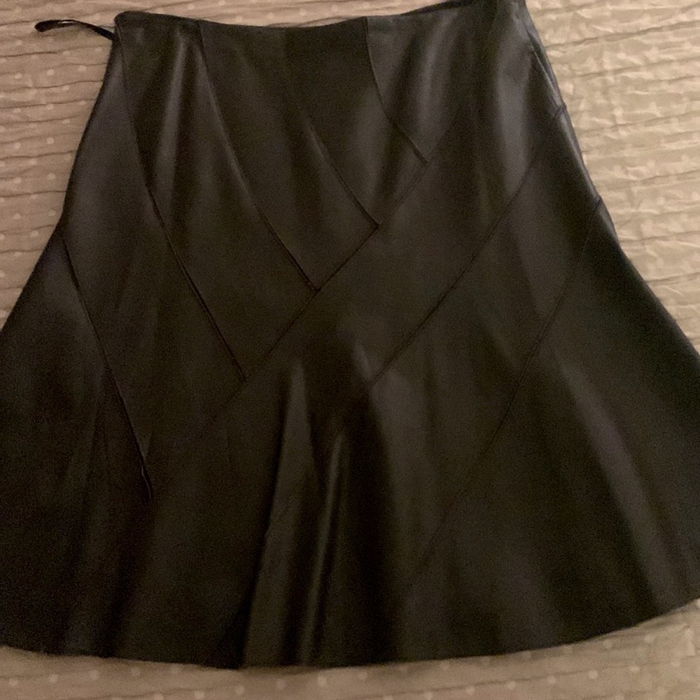 Knee long leather skirt . Full length lining Length 24, waist 16